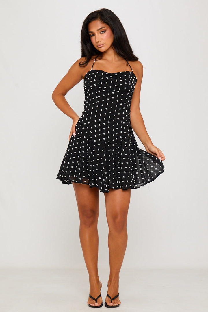 Schwarzes Neckholder-Minikleid mit Punktemuster