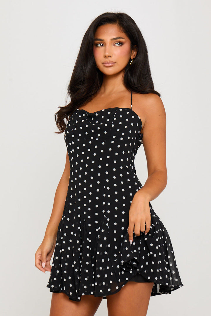 Schwarzes Neckholder-Minikleid mit Punktemuster