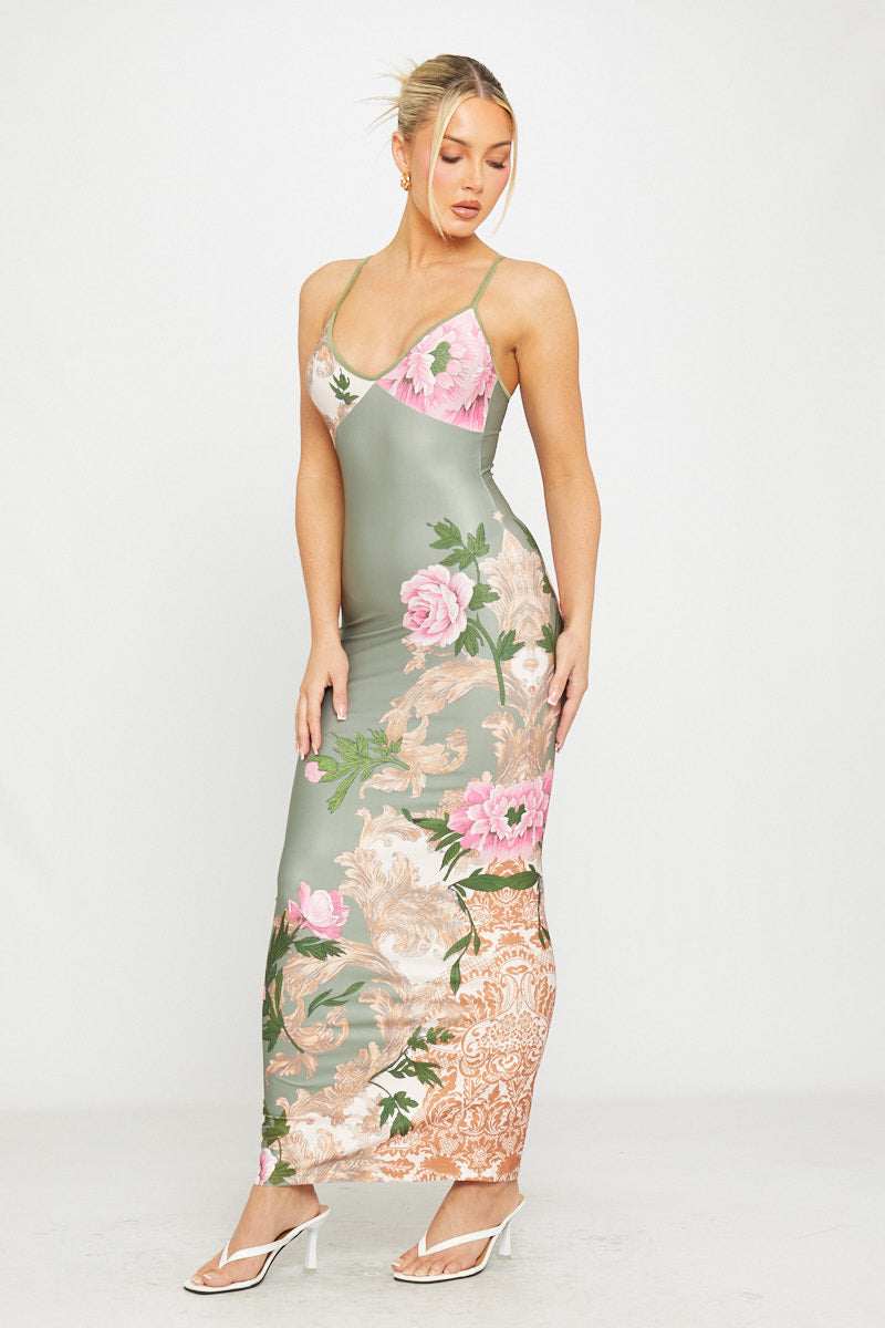 Grünes Maxikleid mit tiefem Ausschnitt und Riemchenmuster
